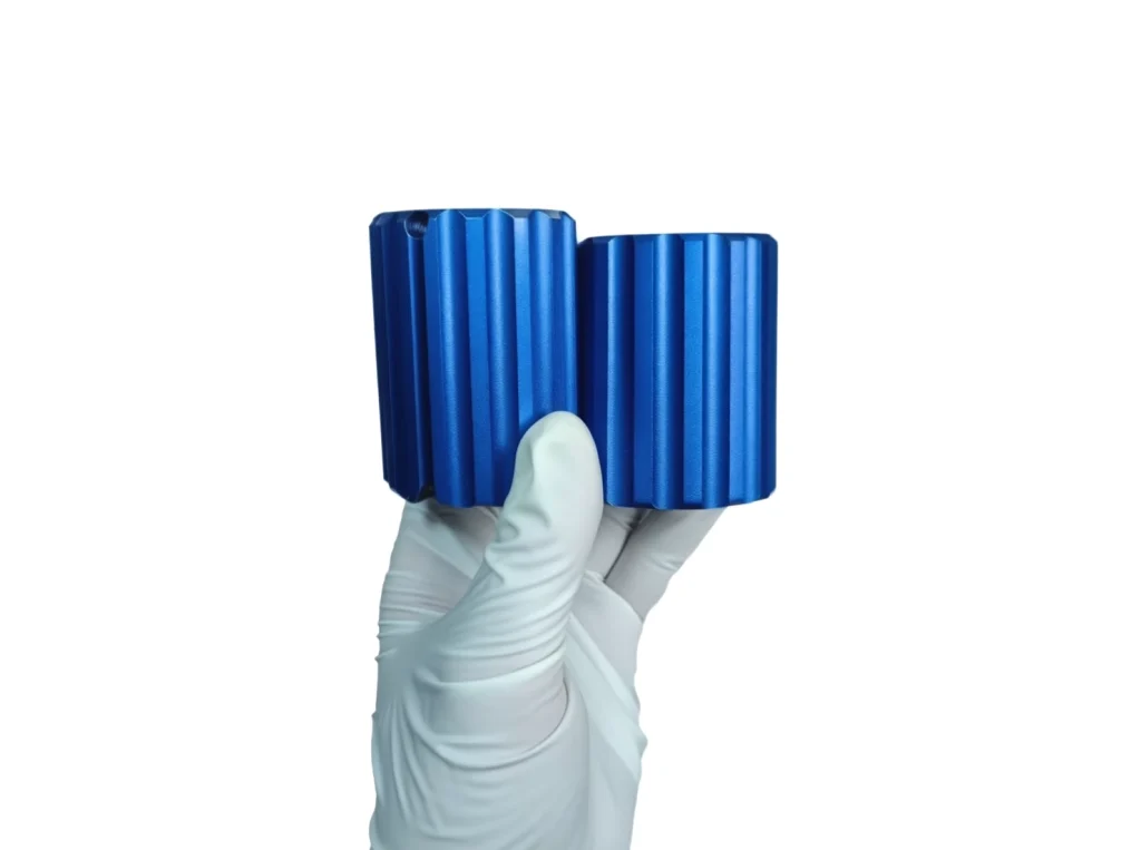 Precision blue anodized aluminum cylinders, expertly machined to showcase 3 axis vs 5 axis cnc machining capabilities for complex geometries.